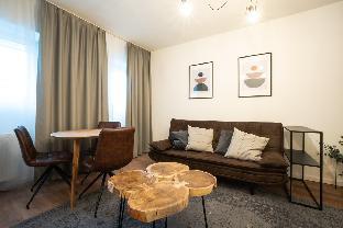 Elegant apartment with wood tables.