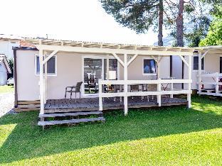Modern mobile home in Bodensdorf with veranda